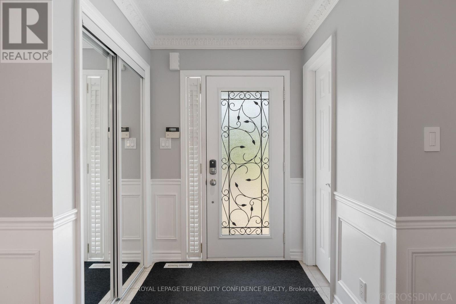 Foyer with mirrored closet, security system