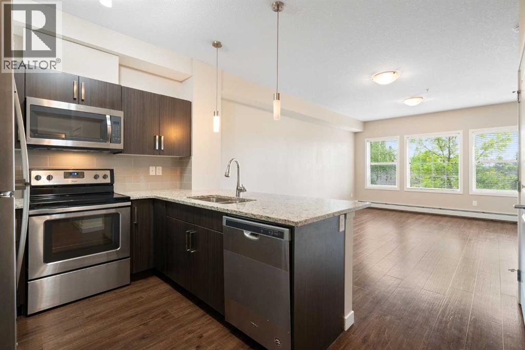 granite countertops, stainless steel appliances, glass subway tile backsplash
