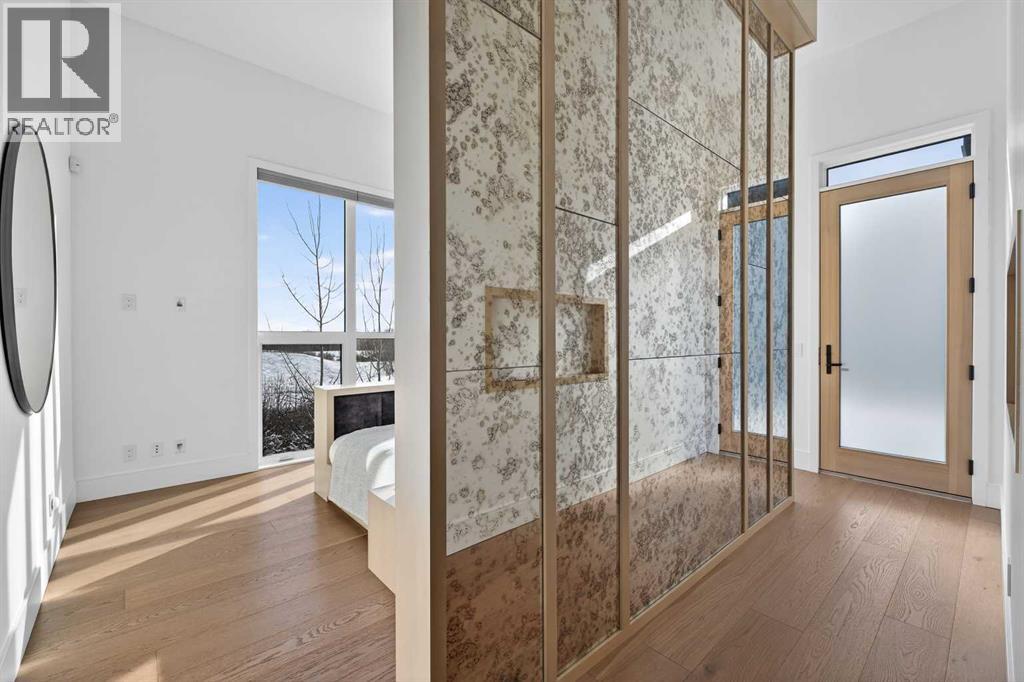 Main floor primary suite with direct access to the back deck