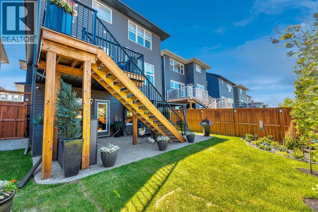 Beautifully landscaped with stairs to the main level