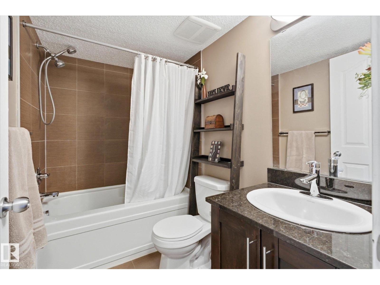 #208 1080 MCCONACHIE BV NW — photo 25