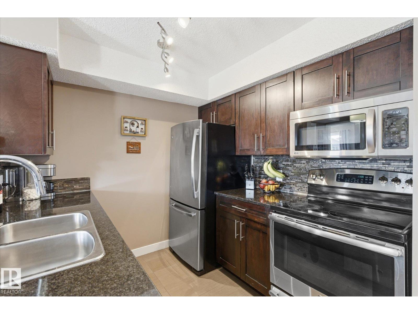 #208 1080 MCCONACHIE BV NW — photo 6