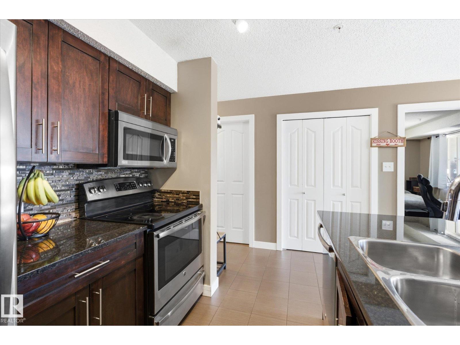 #208 1080 MCCONACHIE BV NW — photo 8