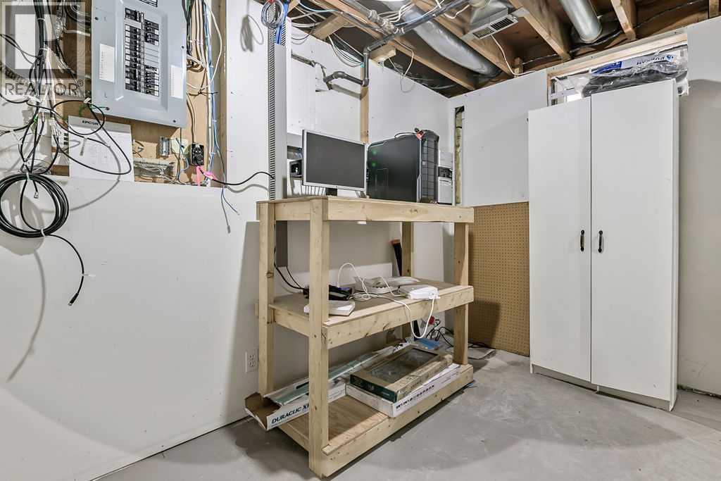 This versatile utility room is perfect for a workshop, hobby space, seasonal storage, or home projects