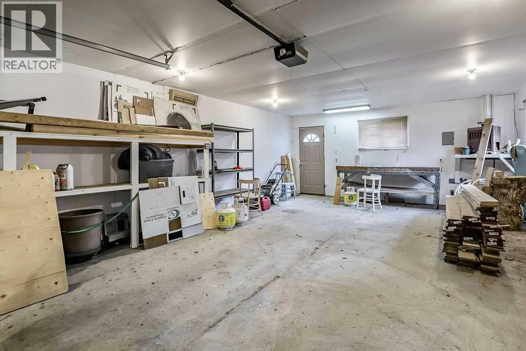 The oversized single garage provides excellent space for parking, storage, tools, and projects