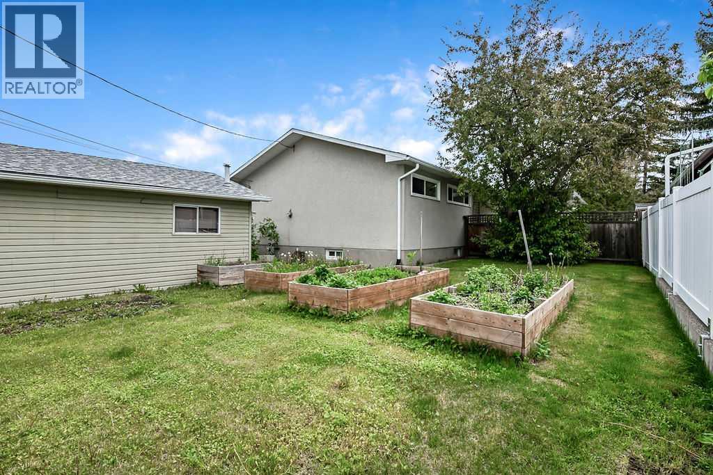 The expansive yard offers plenty of room for gardening, play areas, pets, or future outdoor entertaining spaces