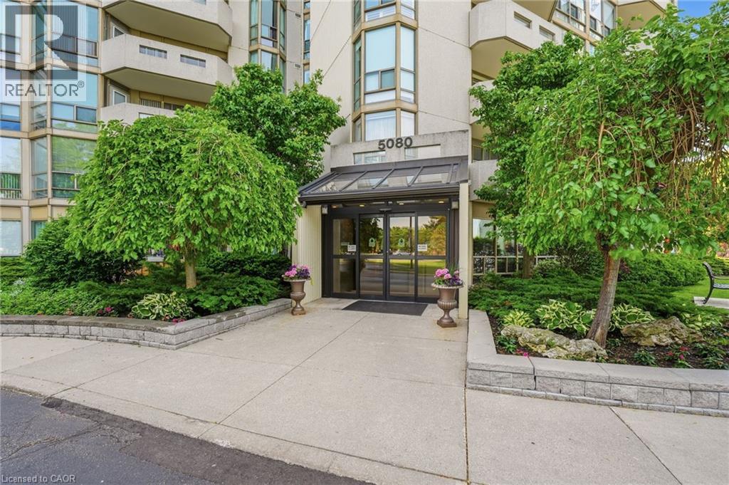 Building entrance with manicured gardens