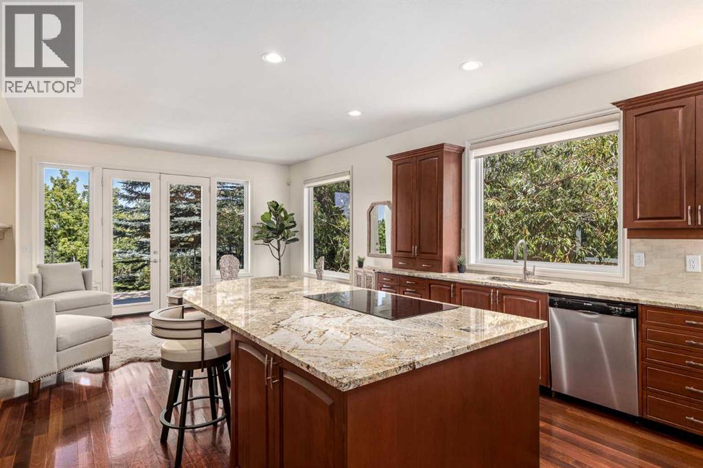 The gourmet kitchen includes custom cabinetry and a large island
