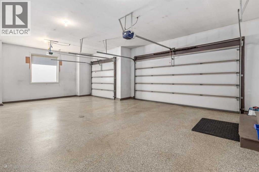 Triple car garage with heated epoxy floors