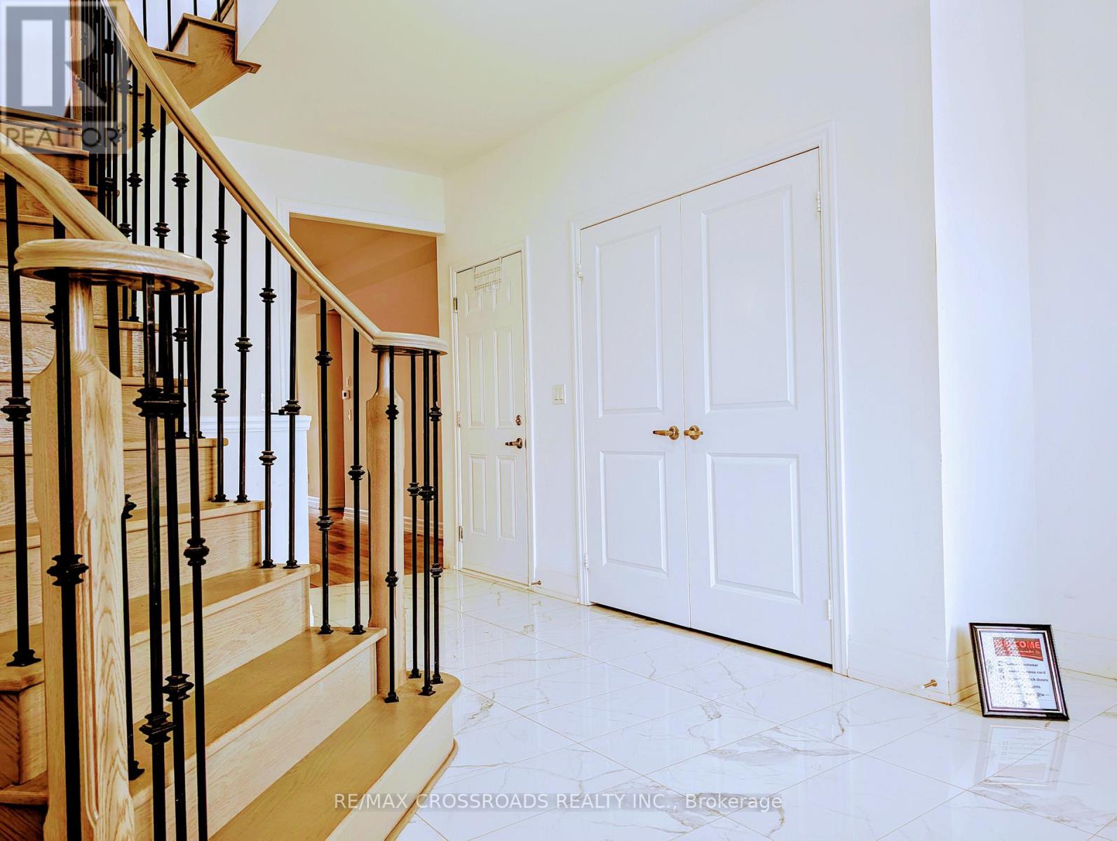 Front foyer, bright, closet & stairwell to upper