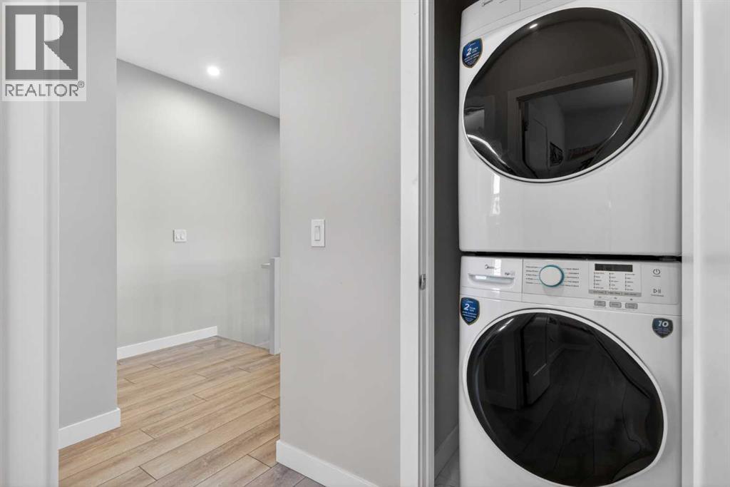 Convenient upper-level laundry with (brandfull-size washer and dryer new)