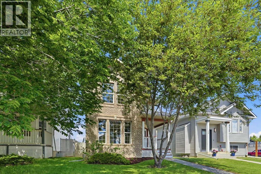 Mature trees and a well landscaped front yard offering the perfect mix of sun and shade in summer