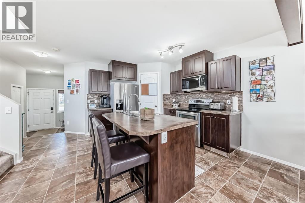 Kitchen with island and breakfast bar
