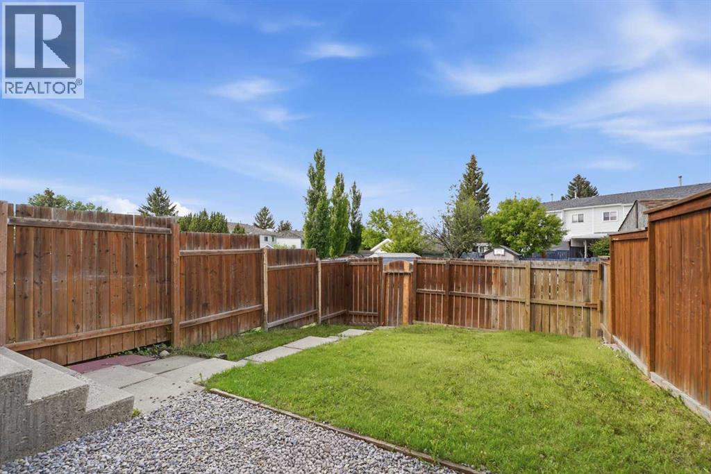 Yard - Gate to back alley with 2 parking spots