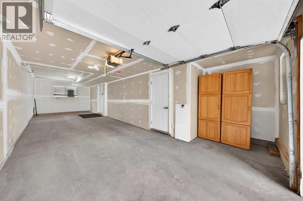 huge double garage with a lot of storage space