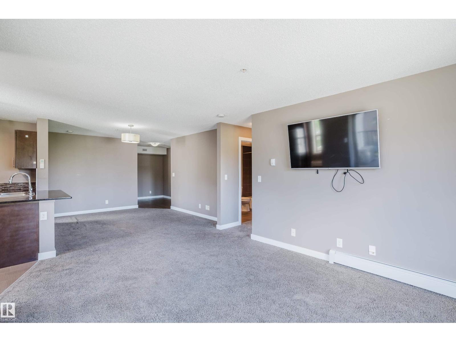 #301 11820 22 AV SW - 23