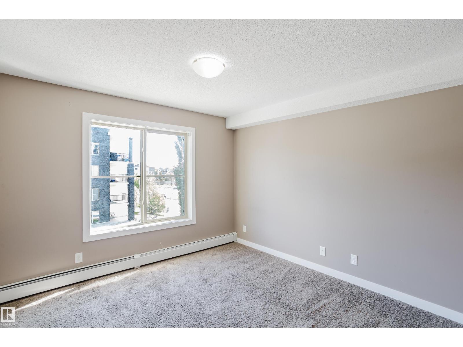 #301 11820 22 AV SW - 32