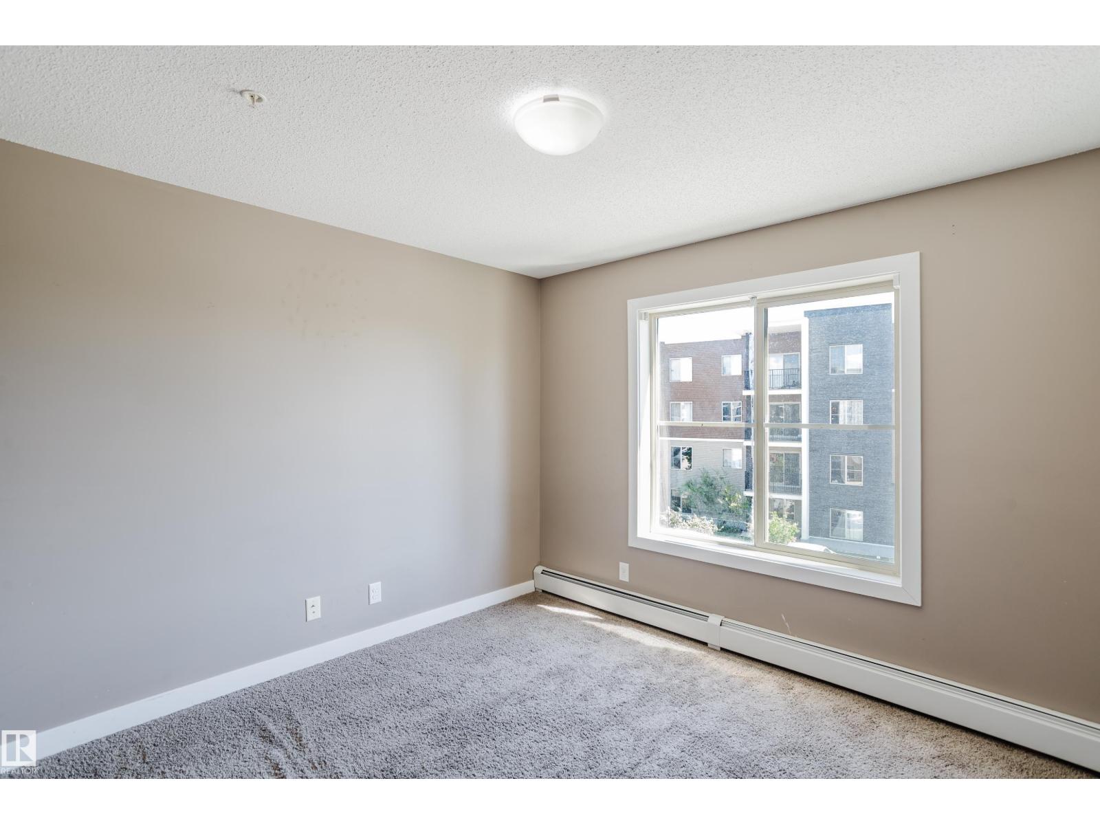 #301 11820 22 AV SW - 38