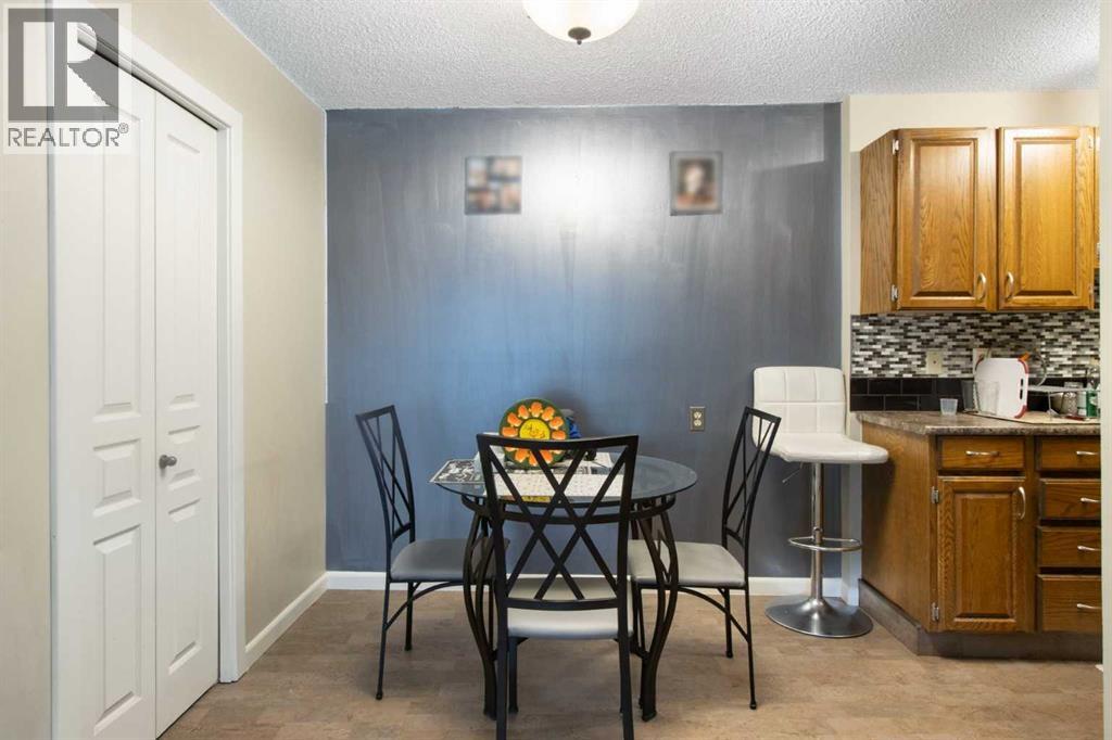Dining area with double doors to pantry/storage to the left