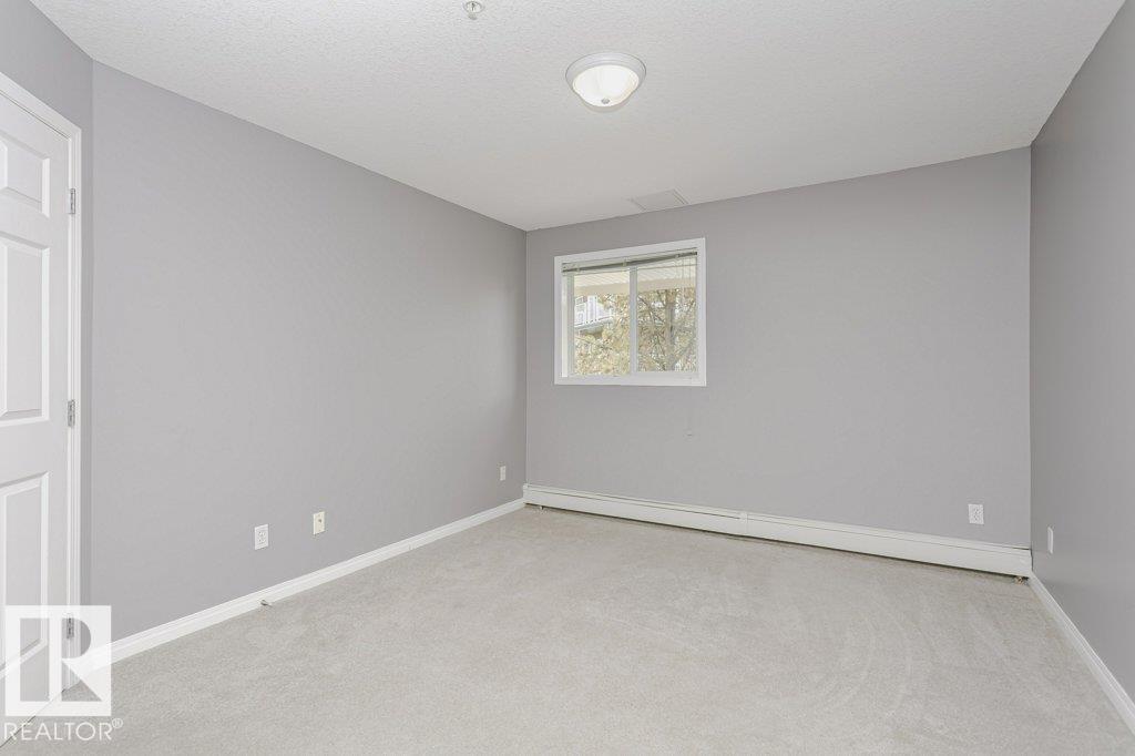 #205 9930 100 AV - 25