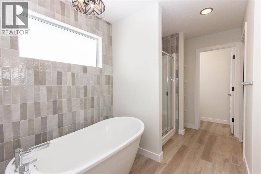 Photos and renderings are examples from a similar home built previously and do not necessarily reflect the finishes and colours used in this home