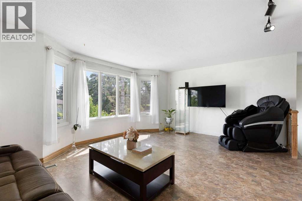 Large living room with huge windows for natural light