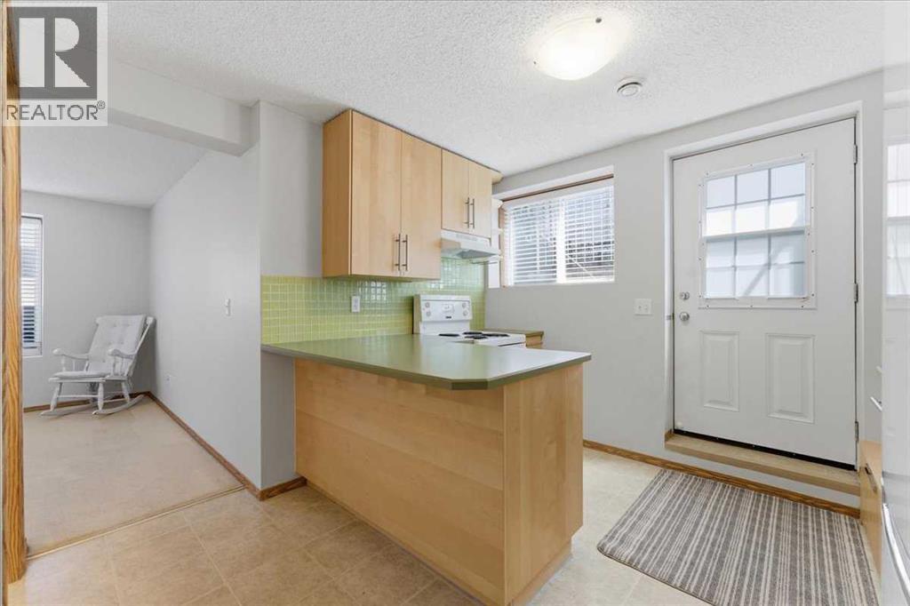 Basement kitchen with walk-up entry