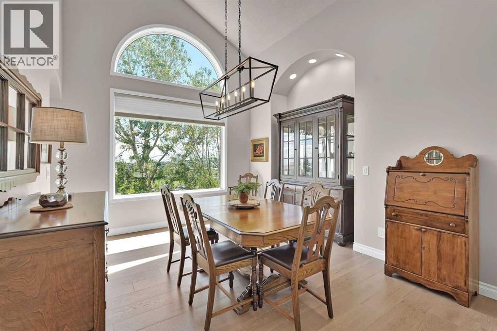 Spacious dining room with views of the golf course. Great for hosting family and friends
