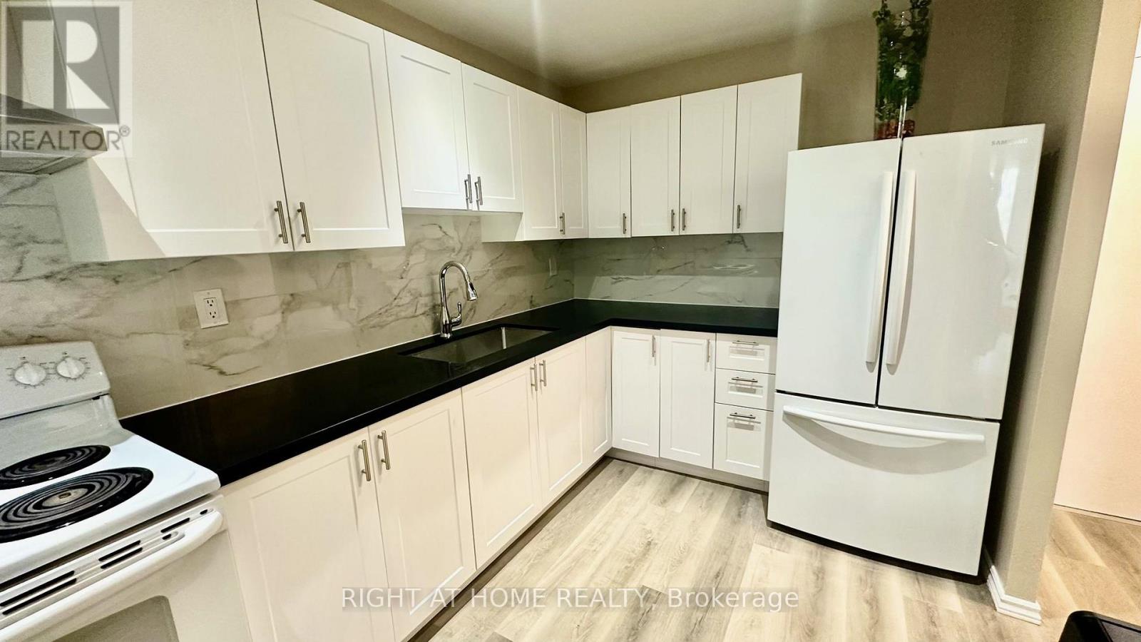 #305 4064 LAWRENCE AVENUE E - 2