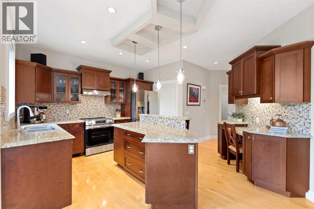 Kitchen with functional island & coffered ceiling detail