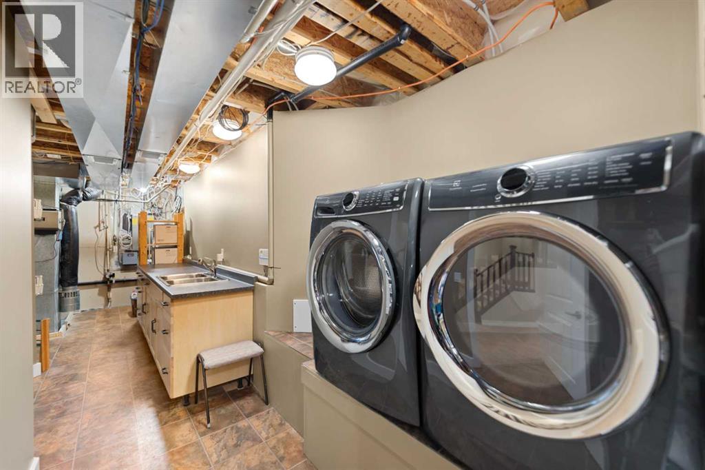 Laundry with sink & excellent storage