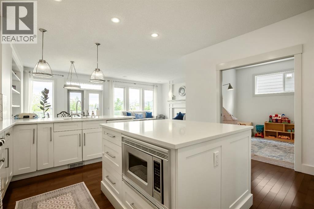Bright Kitchen Overlooking the Pond and Main Living Area