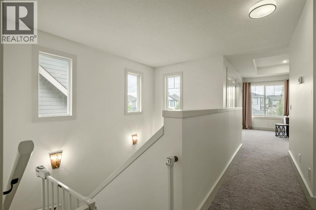 Spacious Upper Hallway with Large Windows