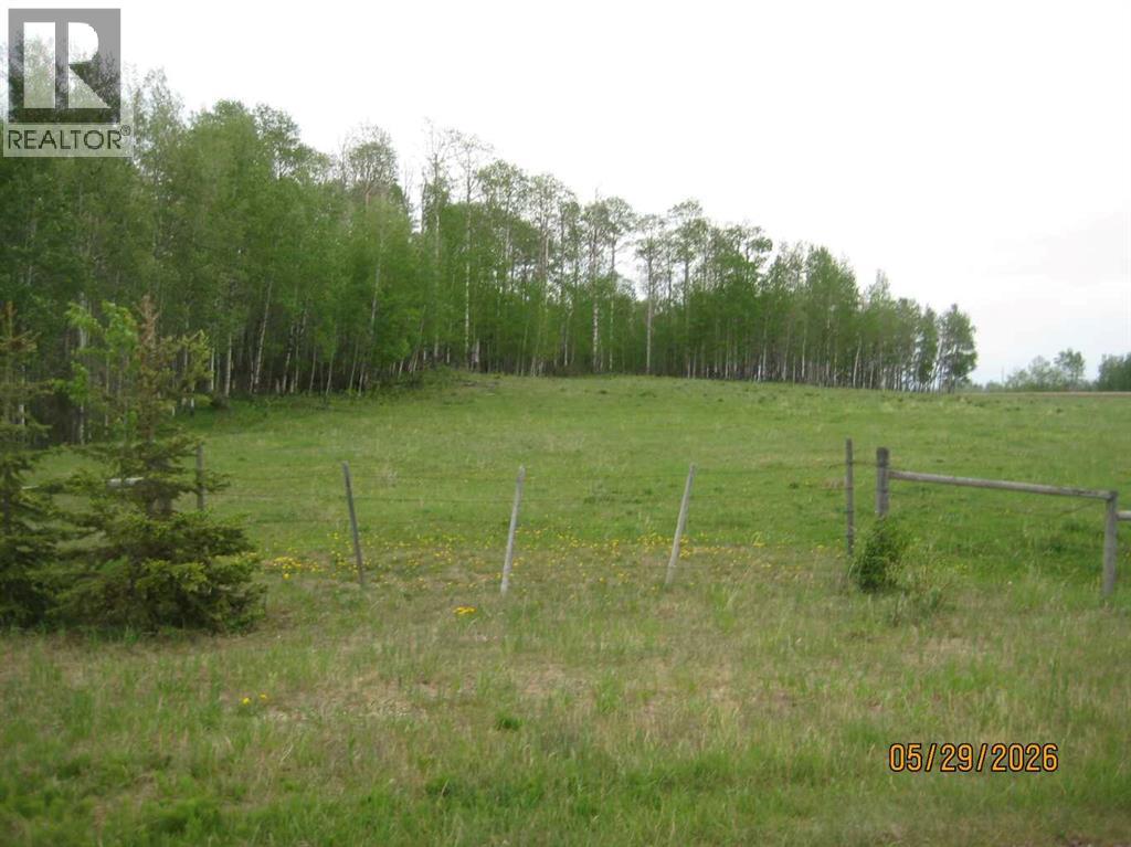 View of the access point along the west boundary taken from the SW corner of the quarter