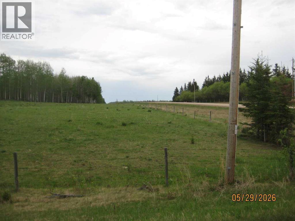 View looking east along the south boundary taken from the SW corner of the quarter