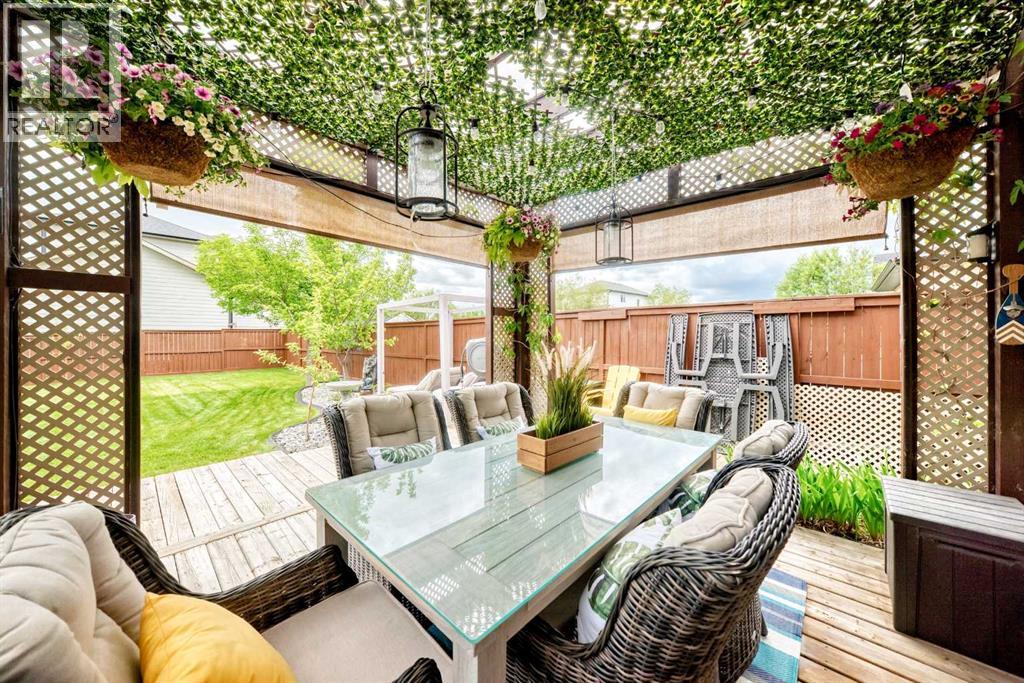 covered gazebo in backyard with curtains
