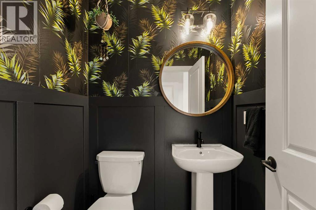 Main level powder room with wallpaper