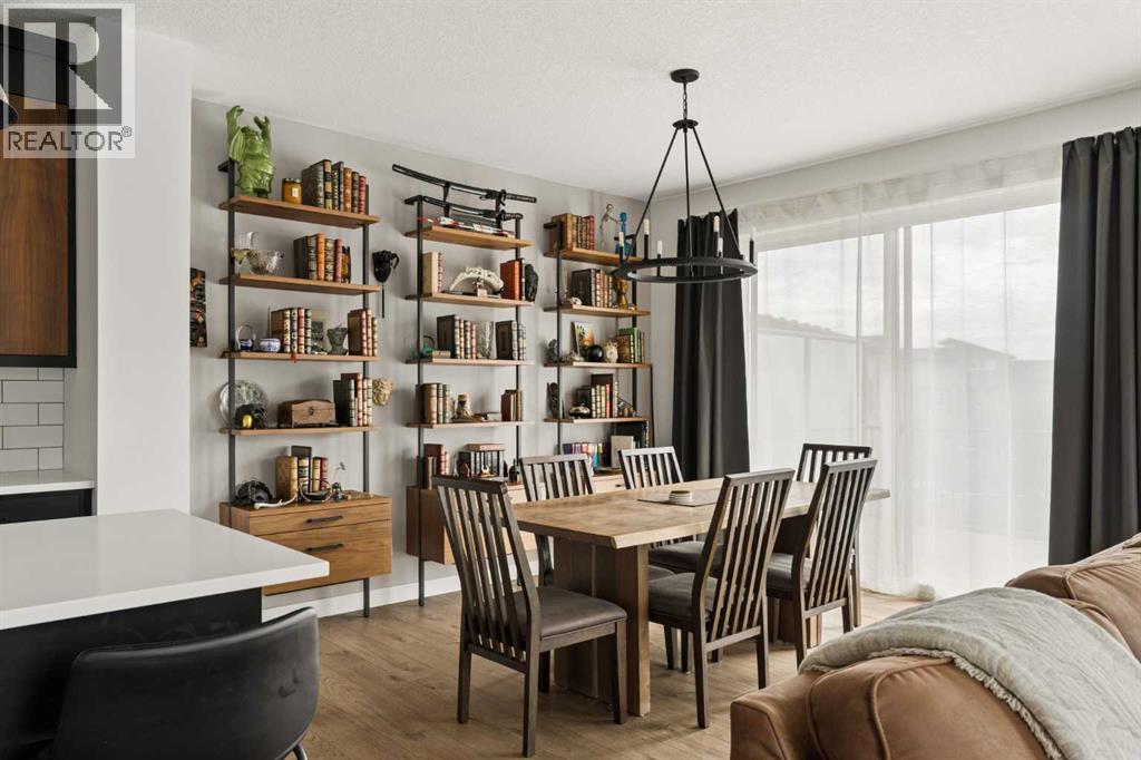Expansive dining area with sliding patio doors provided direct access to the rear composite deck with gas line