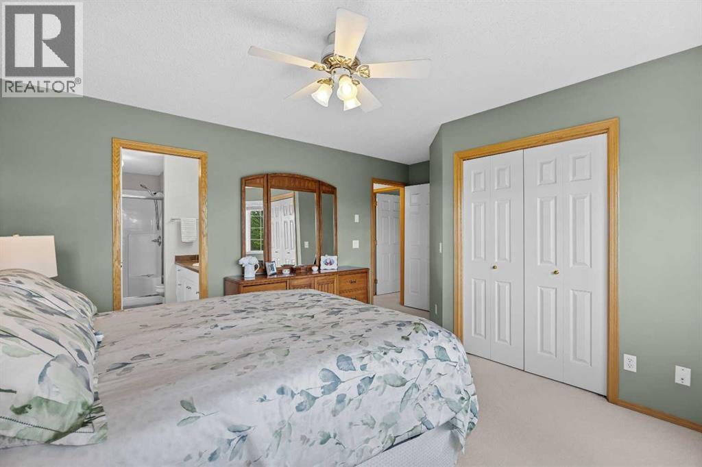 The primary bedroom features double closets and a walk-through to the spa-inspired ensuite - comfort and convenience combined