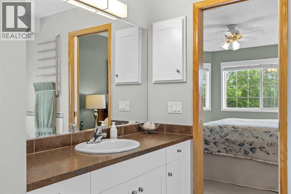 The 5-piece ensuite offers a roomy vanity with ample storage, connecting seamlessly to the primary bedroom