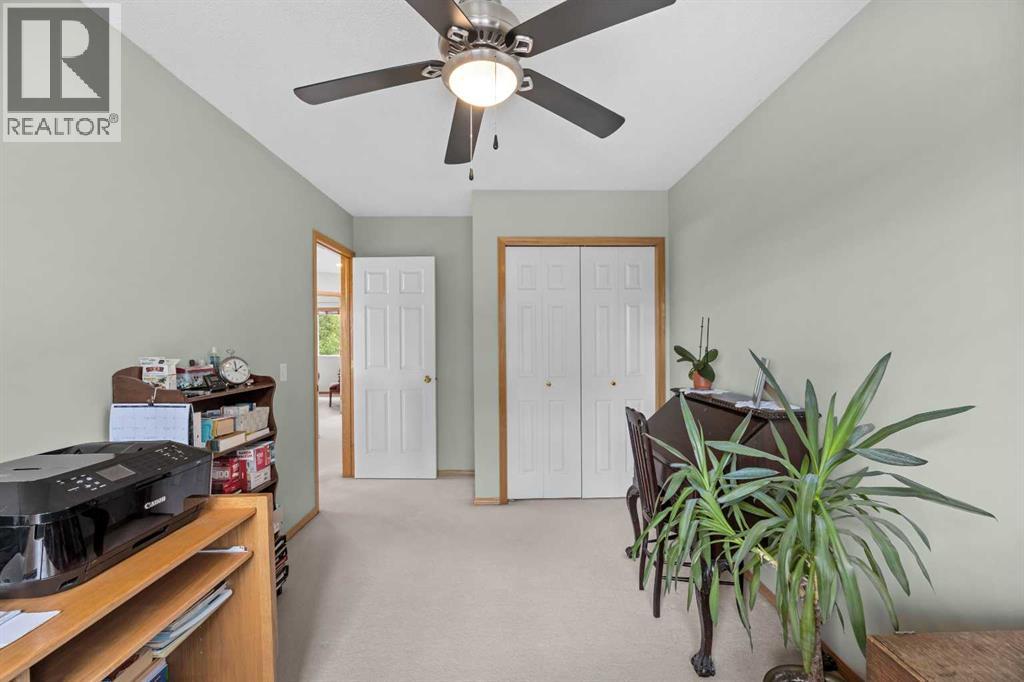 Functional and airy with a ceiling fan and ample space—perfect for working from home or a quiet retreat