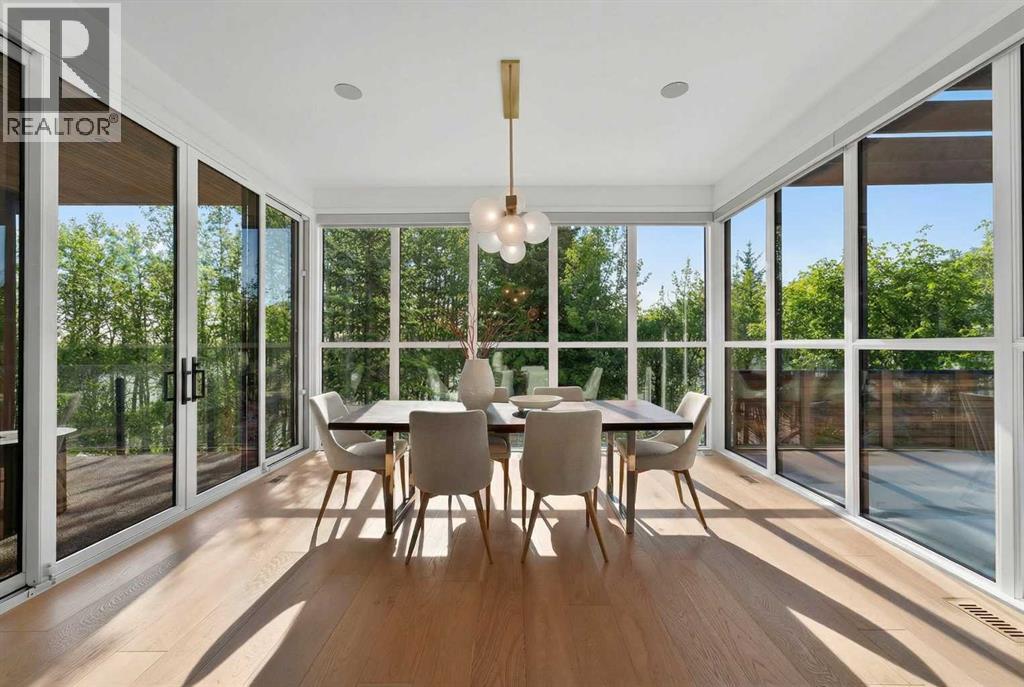 Dine with the trees in this formal dining space that connects to the covered patio area