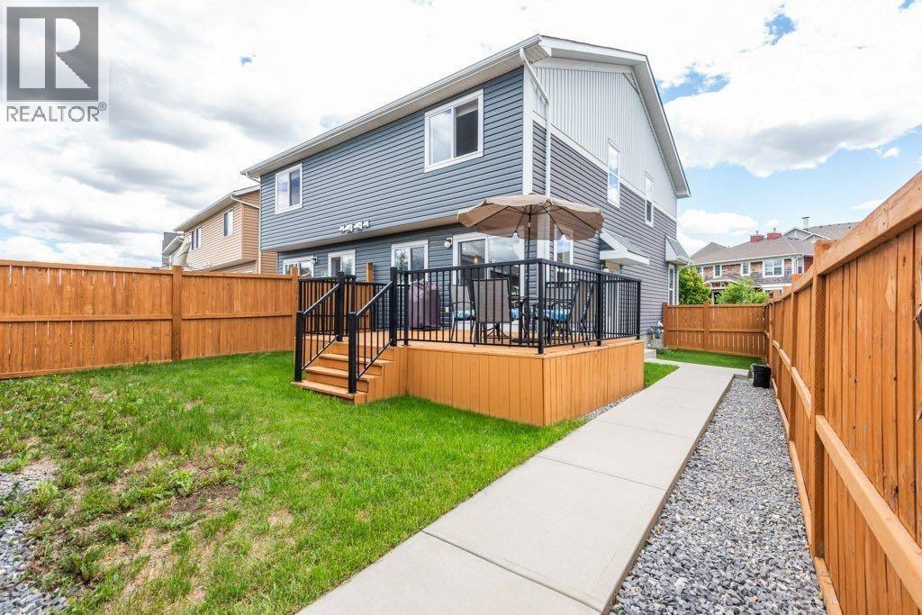 A Good Sized, Fenced Yard with Poured Concrete Sidewalks is a Great Bonus