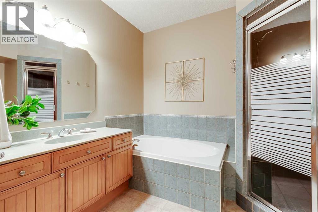 Lower level 4pc bathroom with a soaker tub and features another steam shower