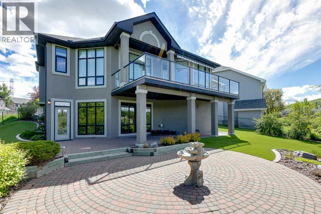 Beautiful interlocking stone patio highlighted by a tranquil fountain, creating the perfect outdoor retreat