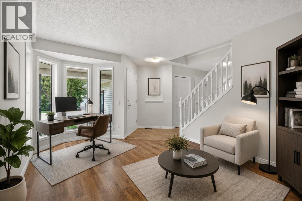 Look at the front Den Space (virtually staged)