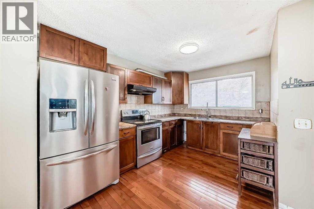 Modern Maple Cabinets ,accented with STAINLESS STEEL APPLIANCES