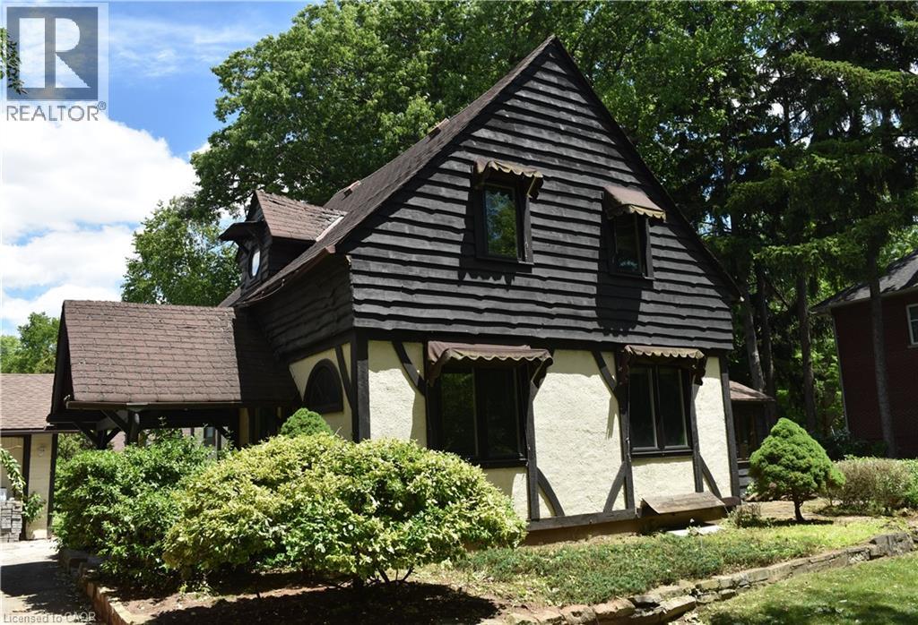 Tudor-style facade featuring exposed timber framing and stucco