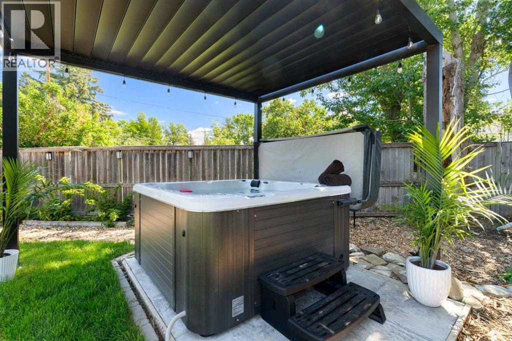 Relax and unwind - this newer, covered hot tub is included