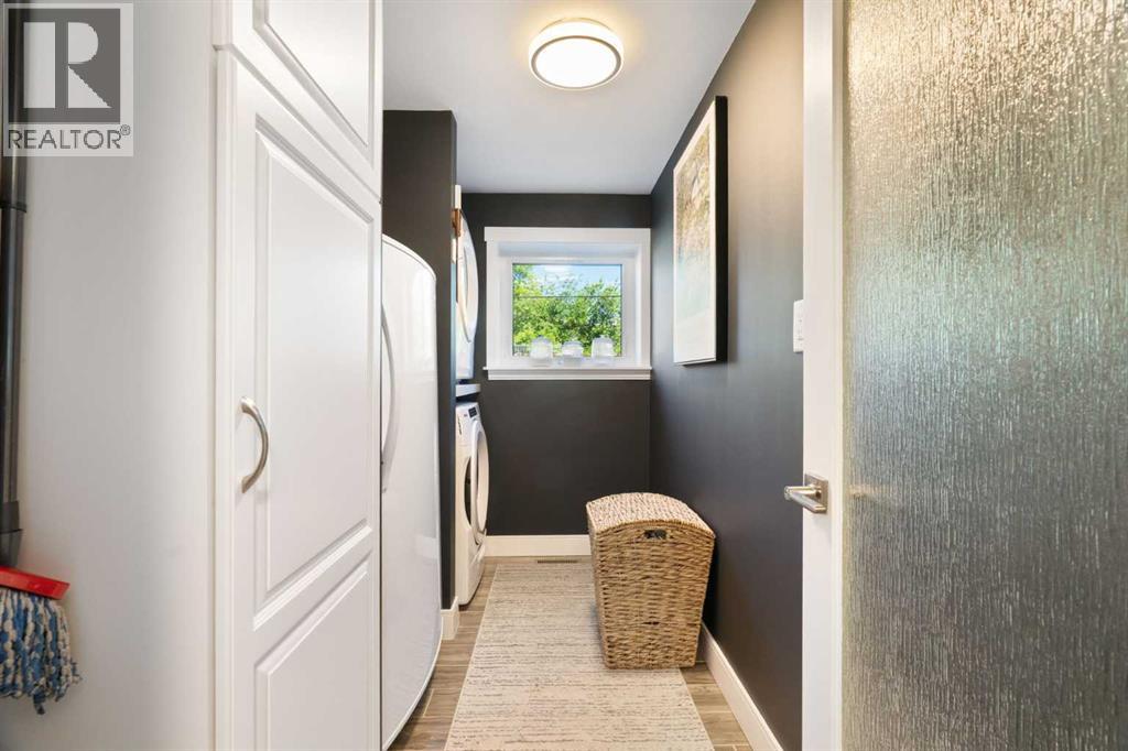 The unique 'mezzanine' level offers a large laundry room complete with built-in storage